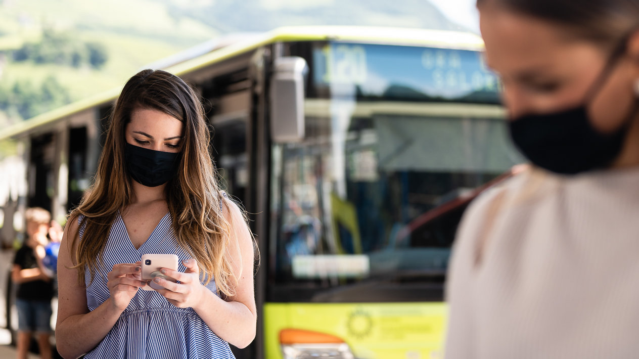 Two passengers at the bus station
